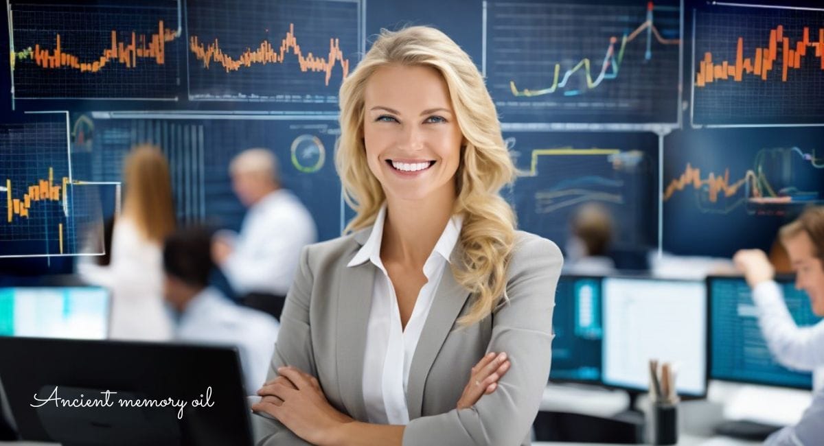 コンピューター画面の前に立つビジネススーツを着た女性。